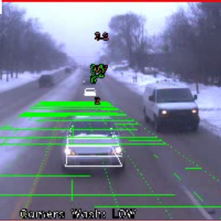 Screenshot of a typical CAMS video, showing following vehicles and the collision-avoidance relative-distance overlay on a snowy road.