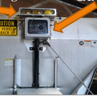 Rear-mounted camera and warning-light equipment evaluated in the master's thesis